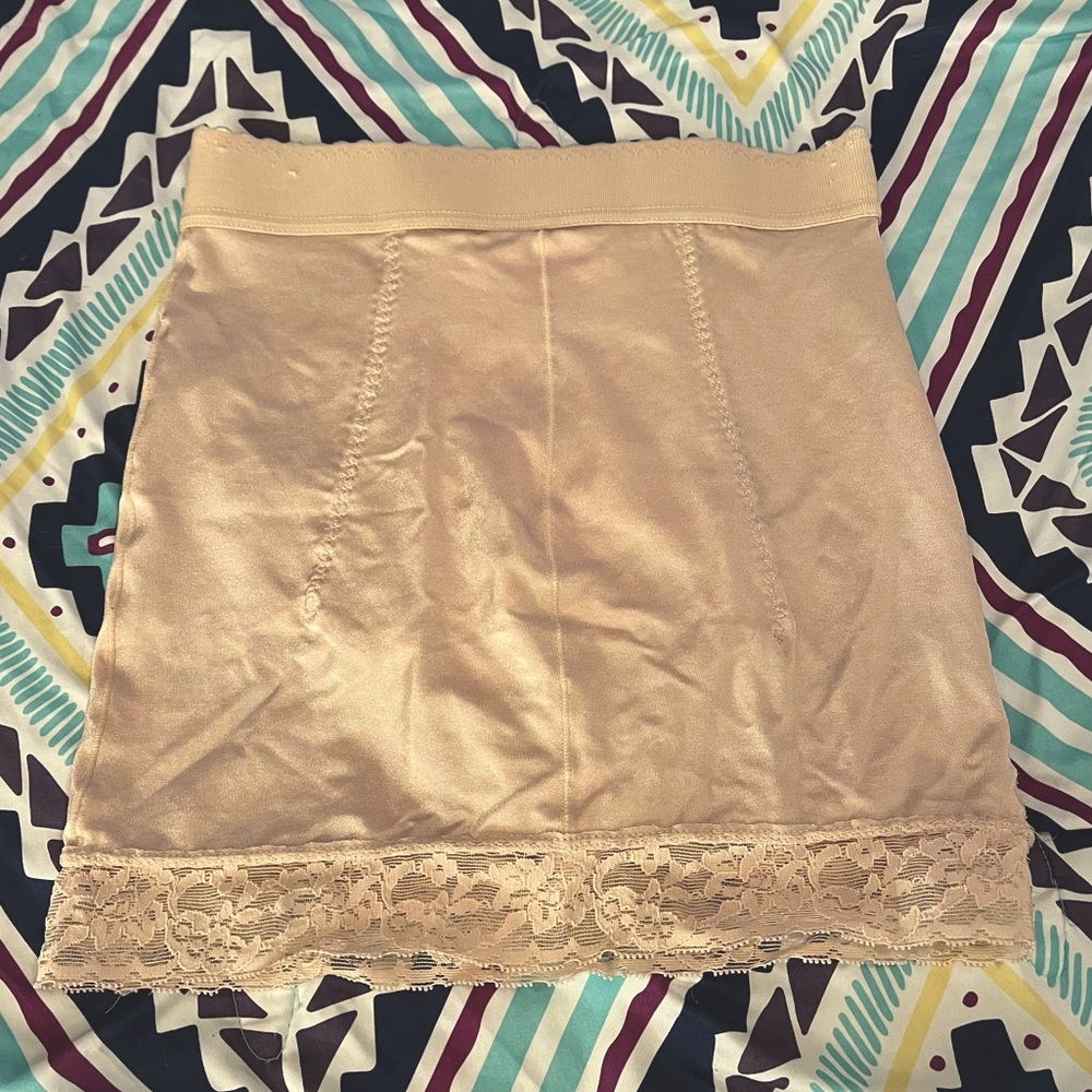 Cupid slip. US size L. Tan. Never worn, very good condition.